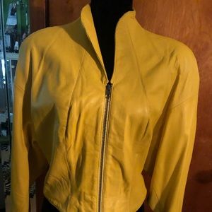 Yellow waist length genuine leather jacket.